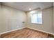 Basement features wood floors and a window providing natural light at 21286 E Nassau Ave, Aurora, CO 80013