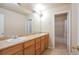 Bathroom boasts a double sink vanity and separate shower tub area at 21286 E Nassau Ave, Aurora, CO 80013