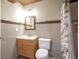Bathroom with vanity, toilet, and stylish, updated, tiled shower area at 21286 E Nassau Ave, Aurora, CO 80013
