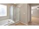 This bathroom offers a separate tub and shower for a relaxing and functional space at 21286 E Nassau Ave, Aurora, CO 80013