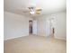 This bright bedroom features an open layout and easy access to the ensuite bathroom at 21286 E Nassau Ave, Aurora, CO 80013