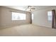 Spacious bedroom with large windows providing ample natural light, creating a comfortable retreat at 21286 E Nassau Ave, Aurora, CO 80013