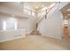 Inviting entrance with a staircase, neutral carpeting, and natural light welcomes you into the home at 21286 E Nassau Ave, Aurora, CO 80013
