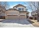 Charming two-story home with a three-car garage and stone accents enhancing curb appeal at 21286 E Nassau Ave, Aurora, CO 80013