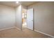 A light and airy hallway that leads to other rooms on the upper level at 21286 E Nassau Ave, Aurora, CO 80013