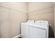 Laundry room with washer, dryer, and shelving at 25064 E Byers Dr, Aurora, CO 80018