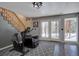 Basement workout area with exercise equipment, stair access and double door access to the outside at 10438 Sunlight Ln, Conifer, CO 80433