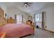 Bedroom with a pitched ceiling, natural light, and traditional wood furniture at 10438 Sunlight Ln, Conifer, CO 80433