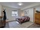Basement bedroom with a cozy bed, window, closet, and a view of the outdoors at 10438 Sunlight Ln, Conifer, CO 80433