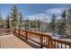 Large outdoor deck offers stunning views of the surrounding landscape at 10438 Sunlight Ln, Conifer, CO 80433