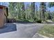 Ample driveway parking with a retaining wall and landscaping at 10438 Sunlight Ln, Conifer, CO 80433