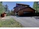 Exterior of a home with a driveway and an attached two car garage at 10438 Sunlight Ln, Conifer, CO 80433