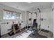 Bright basement gym with weight rack, bench, and ample natural light at 10438 Sunlight Ln, Conifer, CO 80433