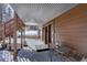 Covered patio area with seating, perfect for relaxing and enjoying the outdoors at 10438 Sunlight Ln, Conifer, CO 80433