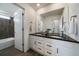 Modern bathroom with dual sinks, sleek countertops, and ample storage space for an organized oasis at 16062 Red Bud Loop, Parker, CO 80134