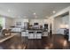Stylish kitchen with stainless appliances, sleek countertops, and center island with bar stool seating at 16062 Red Bud Loop, Parker, CO 80134
