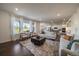 Spacious living room with a large windows, hardwood floors and an open-concept design at 16062 Red Bud Loop, Parker, CO 80134