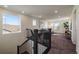 Second floor living area with a large window, railing, and an area rug at 16062 Red Bud Loop, Parker, CO 80134