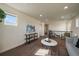 Inviting loft space with modern decor, comfortable seating, and ample natural light from a window at 16062 Red Bud Loop, Parker, CO 80134