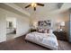 Serene main bedroom with neutral tones, a cozy bed, and an ensuite bathroom view at 16062 Red Bud Loop, Parker, CO 80134