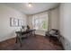 Bright home office with modern decor, a comfortable chair, and natural light from the window at 16062 Red Bud Loop, Parker, CO 80134
