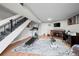 Spacious finished basement with an office area, workout equipment and a cozy fireplace at 6930 S Broadway, Centennial, CO 80122