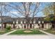 Charming townhomes showcasing individual entrances and nicely manicured lawns at 6930 S Broadway, Centennial, CO 80122