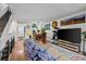 Bright living room featuring a dining area, large television, and comfortable seating at 6930 S Broadway, Centennial, CO 80122