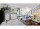 Relaxing living space with a comfortable couch, soft rug, and ample natural light at 6930 S Broadway, Centennial, CO 80122