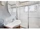 Practical bathroom features a glass door shower, and vessel sink at 6390 W 47Th Ave, Wheat Ridge, CO 80033