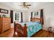 Comfortable bedroom with hardwood floors, and plenty of natural light at 6390 W 47Th Ave, Wheat Ridge, CO 80033