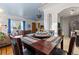 Cozy dining room with wood table, blue ceiling, and natural light at 6390 W 47Th Ave, Wheat Ridge, CO 80033