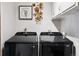 Modern laundry room features front loading washer/dryer at 6390 W 47Th Ave, Wheat Ridge, CO 80033