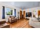 Bright living room with hardwood floors, a large window and ample seating at 6390 W 47Th Ave, Wheat Ridge, CO 80033