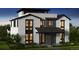 Modern farmhouse exterior with white siding, black trim, and stylish windows, showcasing a contemporary design at 2778 Utica St, Denver, CO 80212
