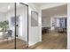Open-concept living space flows into the dining area with modern decor and hardwood floors at 2778 Utica St, Denver, CO 80212