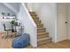 Staircase leading to a cozy study area with modern desk and ample lighting at 2778 Utica St, Denver, CO 80212