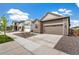 A well-manicured front yard and stone facade enhance the curb appeal of this charming single-Gathering home at 9313 Biscay St, Commerce City, CO 80022