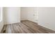 Room features French doors, white walls, light wood floors, and natural light at 9313 Biscay St, Commerce City, CO 80022