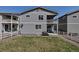 A well-maintained backyard featuring a grill, patio seating and white fencing for a relaxing outdoor experience at 3945 John Ave, Castle Rock, CO 80104