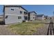 The home features a private, fenced backyard with patio, ideal for outdoor enjoyment and activities at 3945 John Ave, Castle Rock, CO 80104