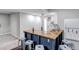 Finished basement bar area with custom wood counters, wet bar, bar seating, and tiled backsplash at 3945 John Ave, Castle Rock, CO 80104