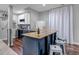 Basement bar area with a wooden countertop, wine fridge, sink, shelving, and stylish stools at 3945 John Ave, Castle Rock, CO 80104