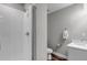 Clean bathroom features a shower stall with white tile and a modern sink and toilet at 3945 John Ave, Castle Rock, CO 80104
