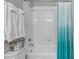 Clean bathroom with a shower featuring a shower curtain and white tiling at 3945 John Ave, Castle Rock, CO 80104