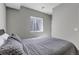 Bedroom featuring a queen-sized bed and neutral carpeting at 3945 John Ave, Castle Rock, CO 80104
