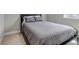 Bedroom featuring a queen-sized bed and neutral carpeting at 3945 John Ave, Castle Rock, CO 80104