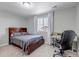Bedroom featuring a queen-sized bed, work desk and neutral carpeting at 3945 John Ave, Castle Rock, CO 80104