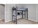 Bedroom featuring a bunk bed with a desk and neutral carpeting at 3945 John Ave, Castle Rock, CO 80104