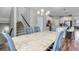 A Dining Room with seating for six and staircase to the second floor at 3945 John Ave, Castle Rock, CO 80104